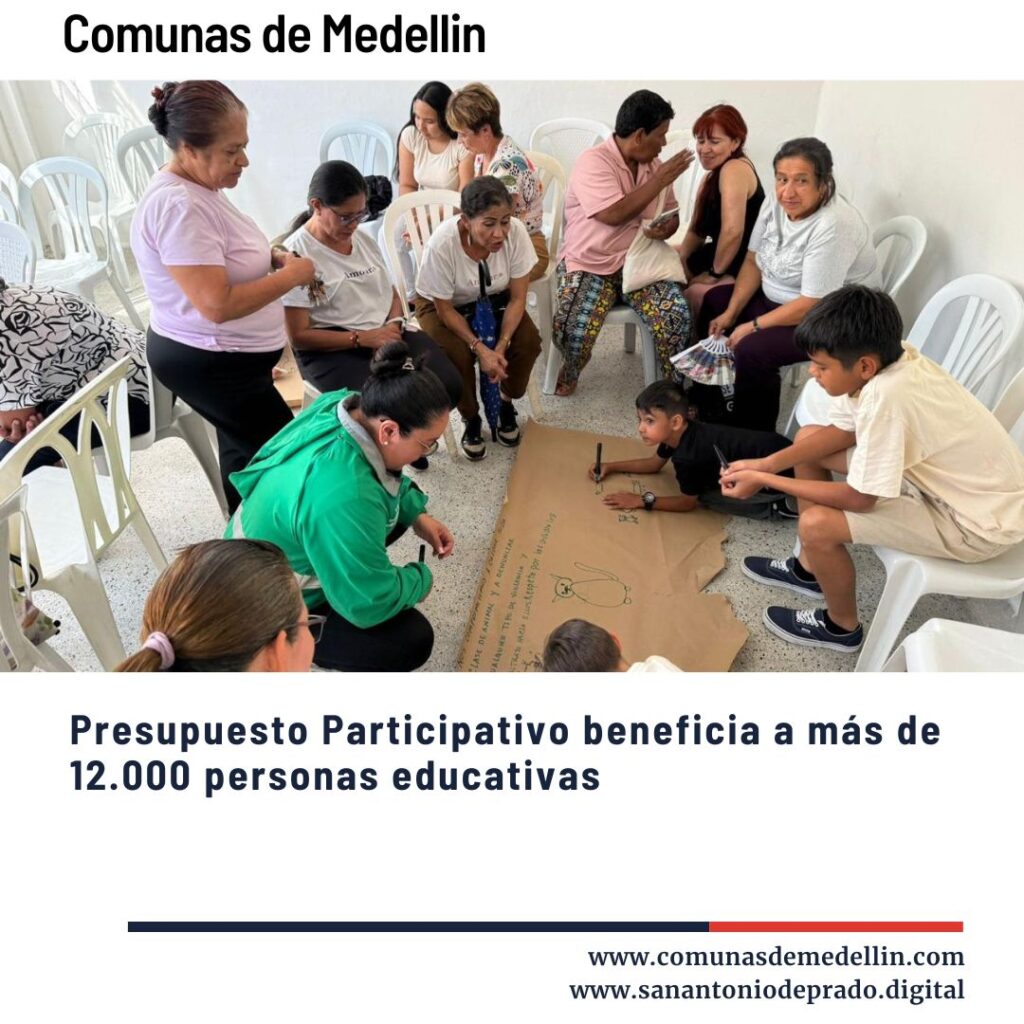 Grupo de adultos y niños participando en una actividad educativa comunitaria del Presupuesto Participativo en las comunas de Medellín