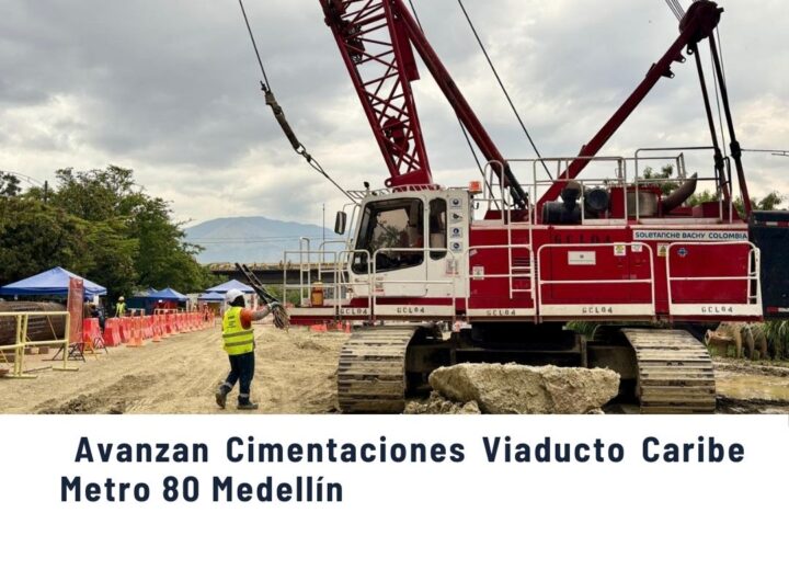 Grúa de gran capacidad trabajando en las cimentaciones del Viaducto Caribe del Metro 80 en Medellín, avance de obra en las comunas.
