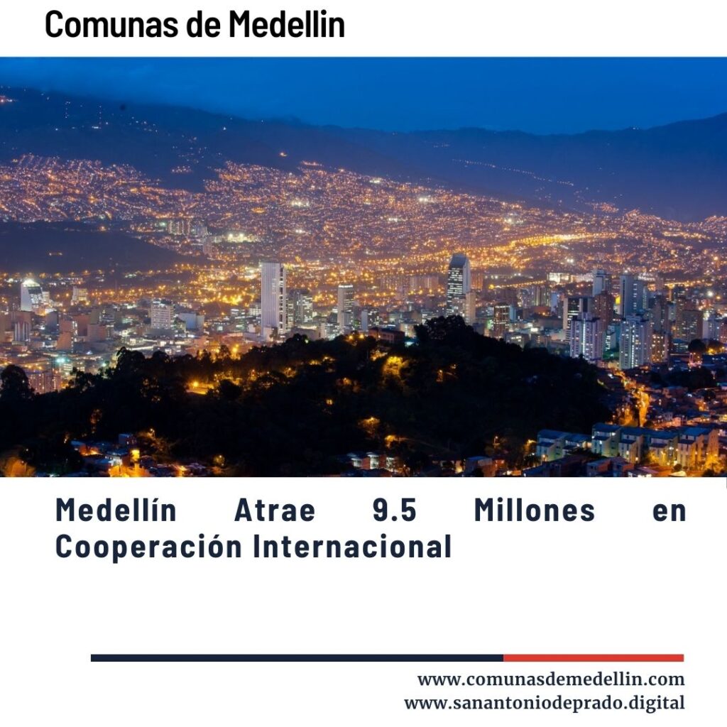 Vista panorámica nocturna de Medellín iluminada, destacando su desarrollo urbano y atracción de 9.5 millones en cooperación internacional.